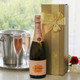 Veuve Clicquot Rosé Champagne gift set with gold box, yellow ribbon, champagne flutes, and floral accents – luxury gift for celebrations and special occasions. Veuve Clicquot Rosé Champagne gift set with gold box, yellow ribbon, champagne flutes, and floral accents – luxury gift for celebrations and special occasions.